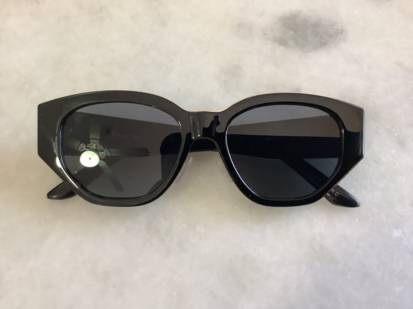 Modern “wayfarer” sunglasses with gold trim