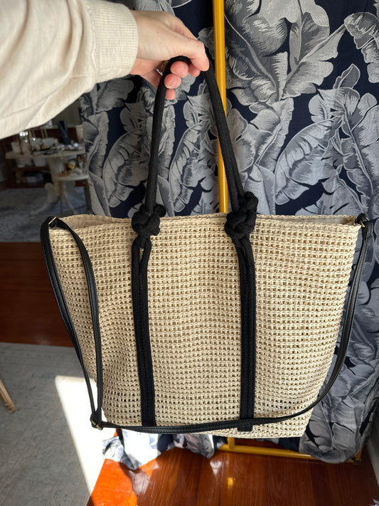 Straw tote w/black handles and crossbody strap
